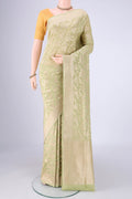 Light Green Banarasi Silk Saree with Zari Brocade on the body and Zari Border.  displayed on a mannequin