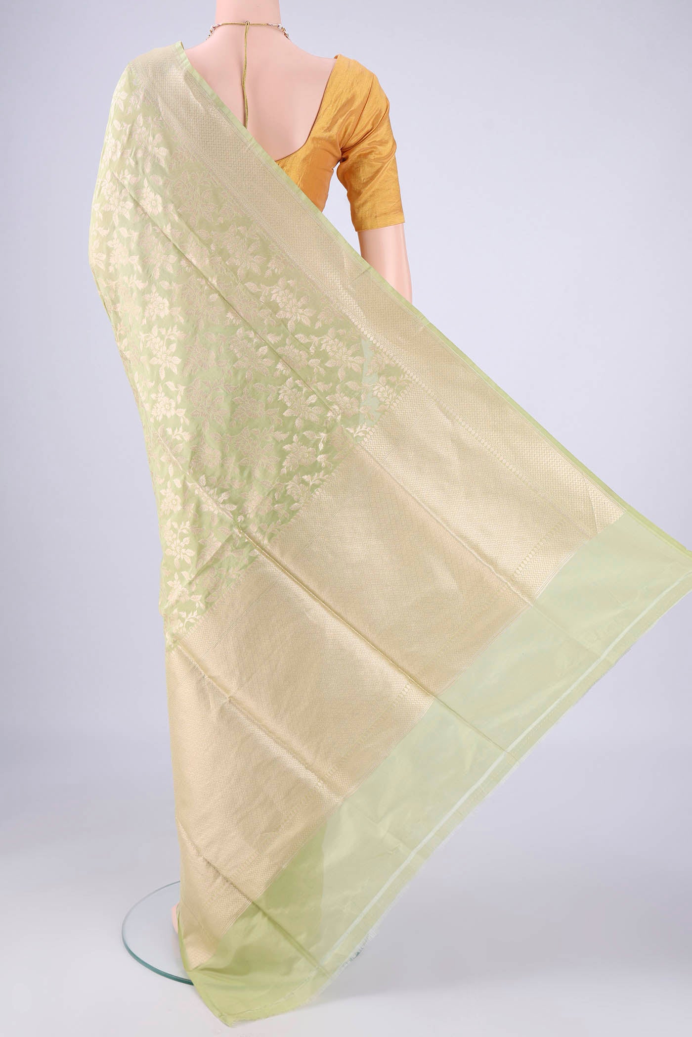 Flat view of Light Green Banarasi Silk Saree with Zari Brocade on the body and Zari Border. 