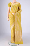 Yellow Banarasi Silk Saree with Stripes on the body and Zari Border.  displayed on a mannequin