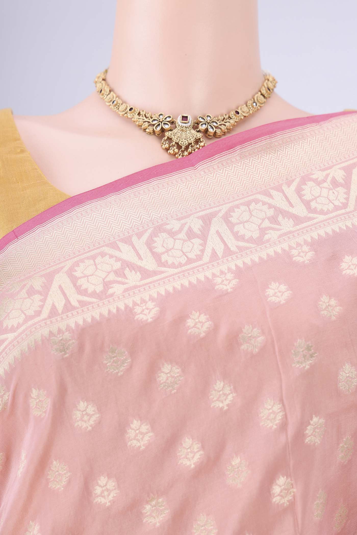 Border image of Peach Banarasi Silk Saree with Zari Butta on the body and Zari Border. 
