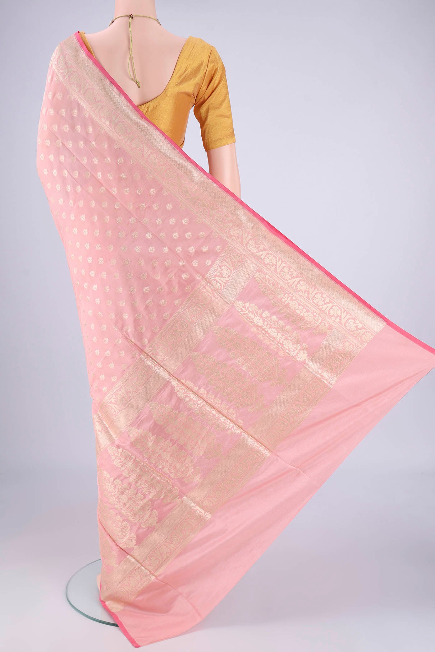 Flat view of Peach Banarasi Silk Saree with Zari Butta on the body and Zari Border. 