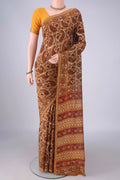 Mustard Maheshwari Cotton Saree with Batik Print on the body and Zari Border.  displayed on a mannequin