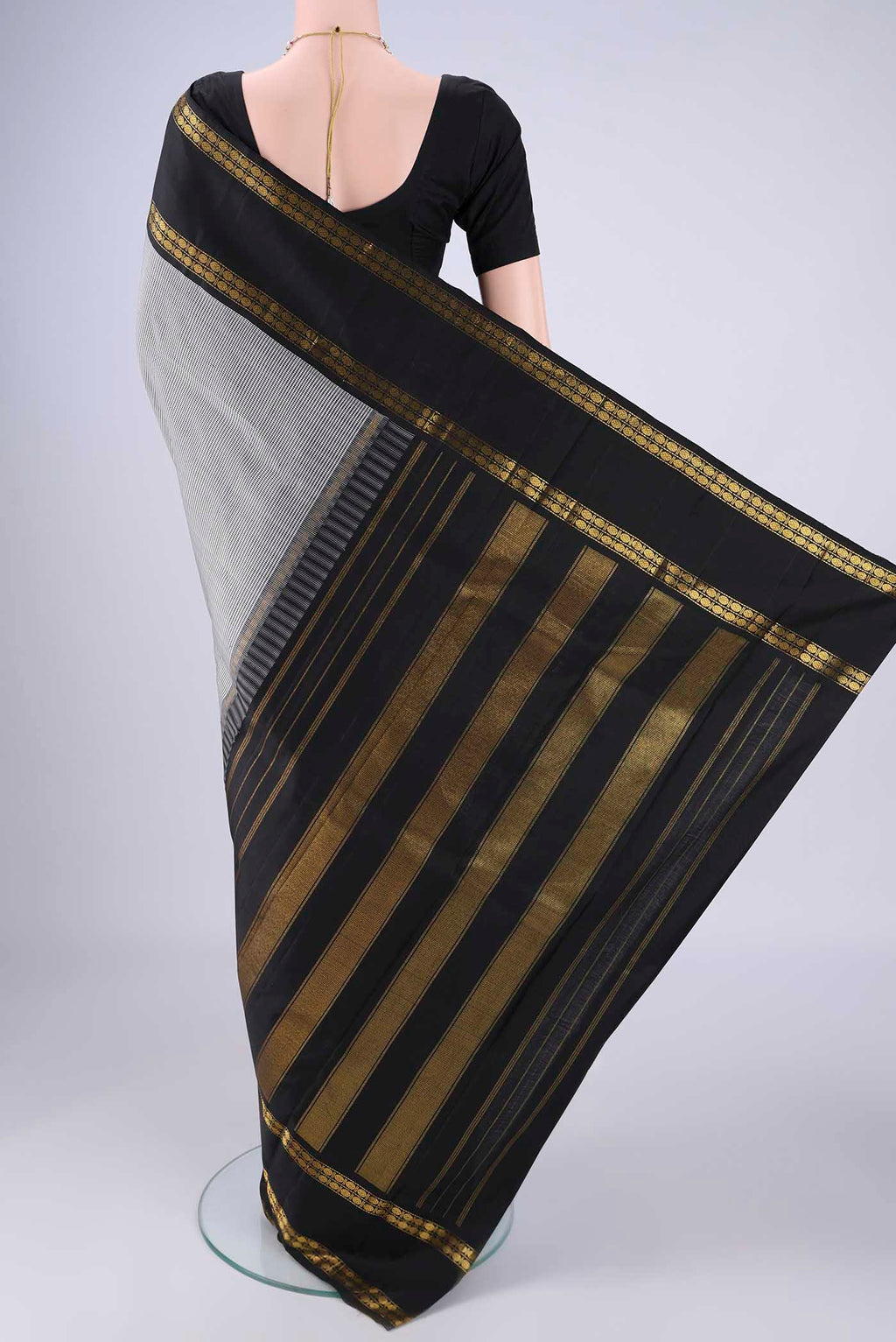 Flat view of White Kanchipuram Silk Saree with Checked design on the body and Zari Border. 