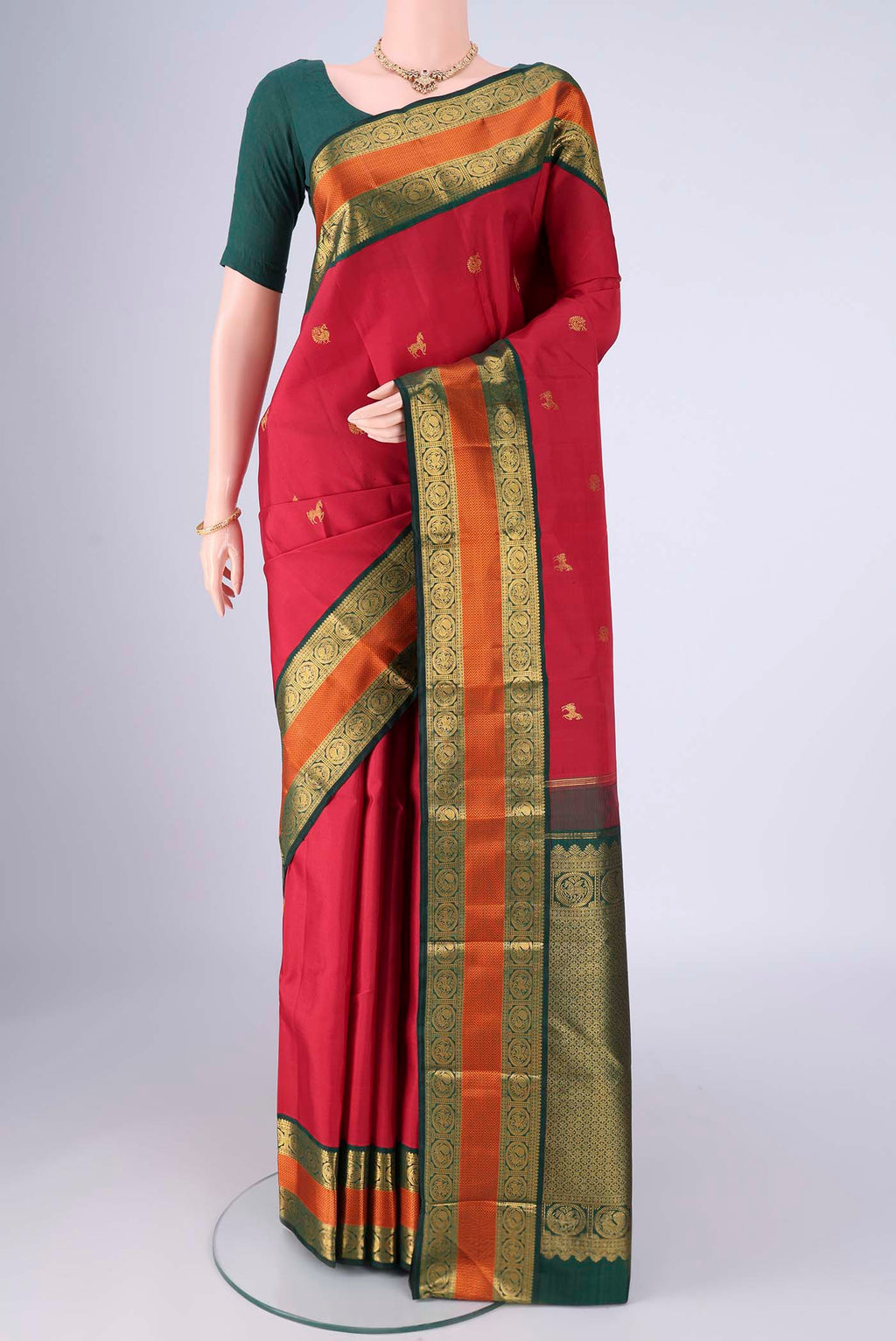 Maroon Kanjivaram Silk Saree with Zari Butta on the body and Zari And Thread Border.  displayed on a mannequin