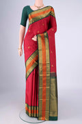 Maroon Kanjivaram Silk Saree with Zari Butta on the body and Zari And Thread Border.  displayed on a mannequin