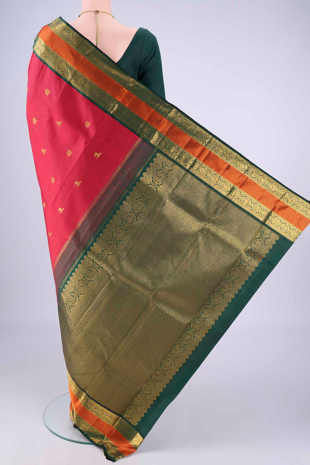 Flat view of Maroon Kanjivaram Silk Saree with Zari Butta on the body and Zari And Thread Border. 