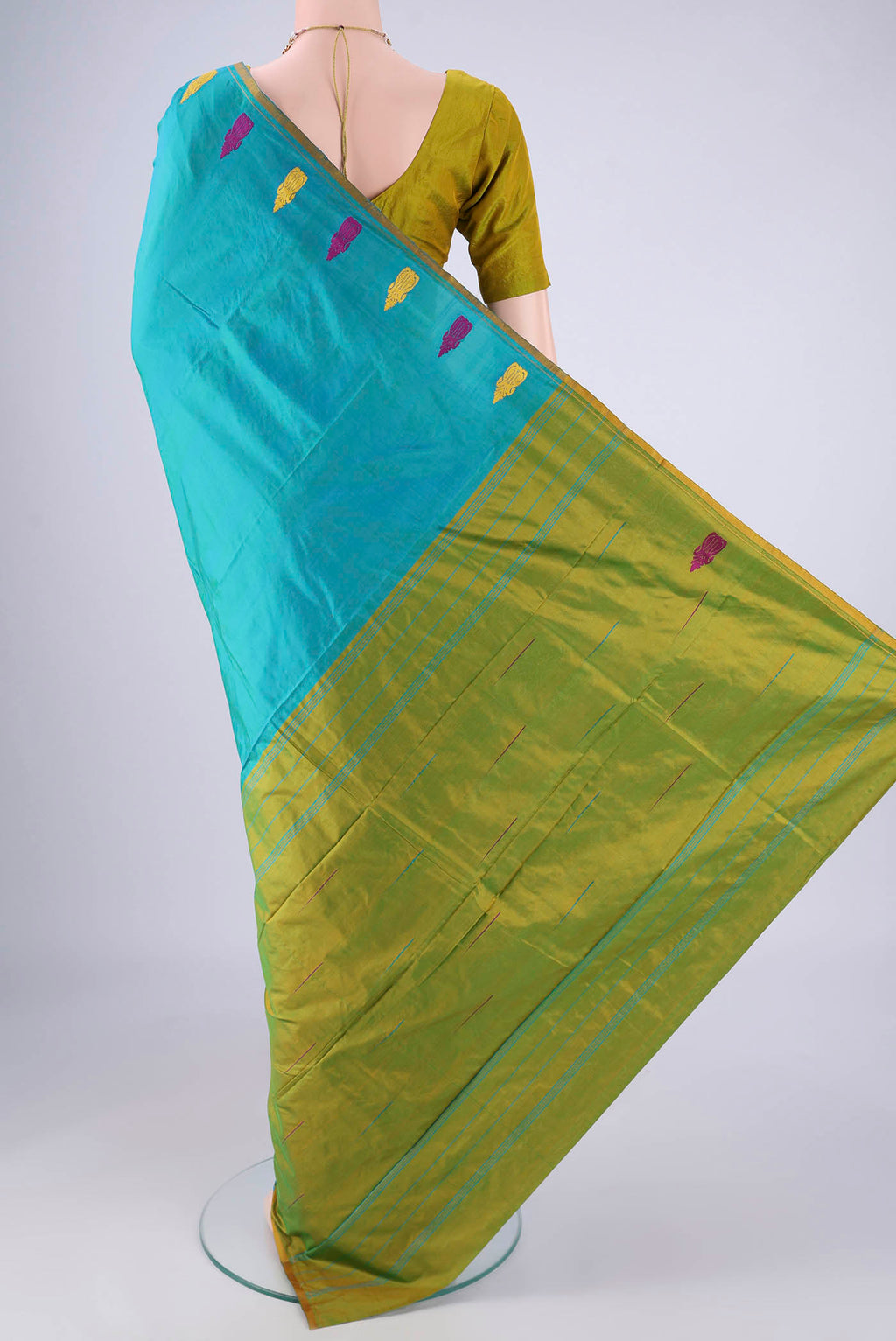 Flat view of Turquoise Kanchipuram Silk Saree with Plain Body and Thread Border. 