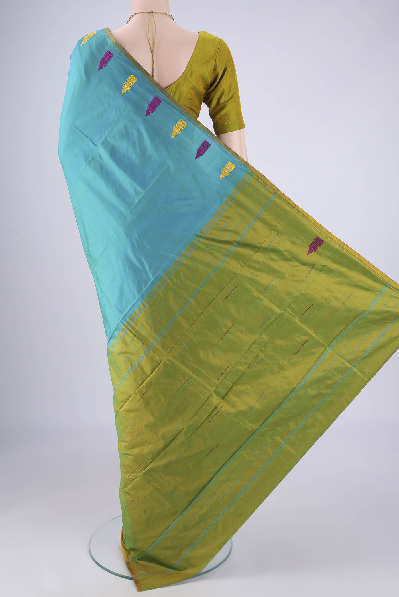 Flat view of Turquoise Kanchipuram Silk Saree with Plain Body and Thread Border. 