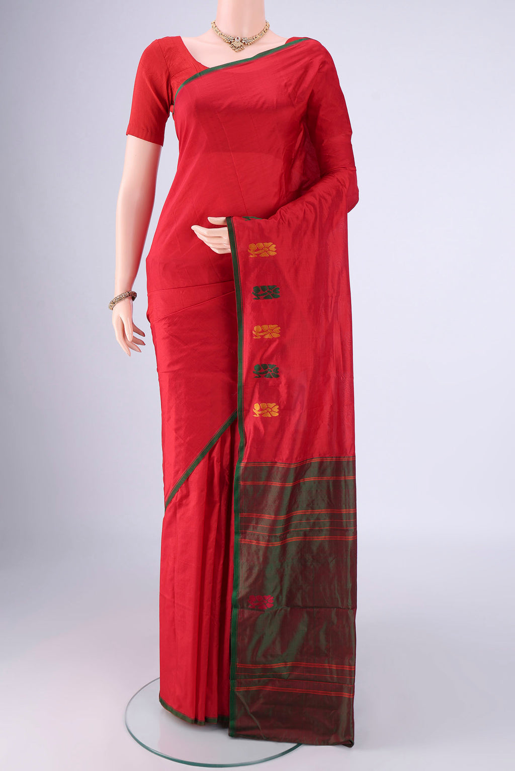 Maroon Kanchipuram Silk Saree with Plain Body and Thread Border.  displayed on a mannequin