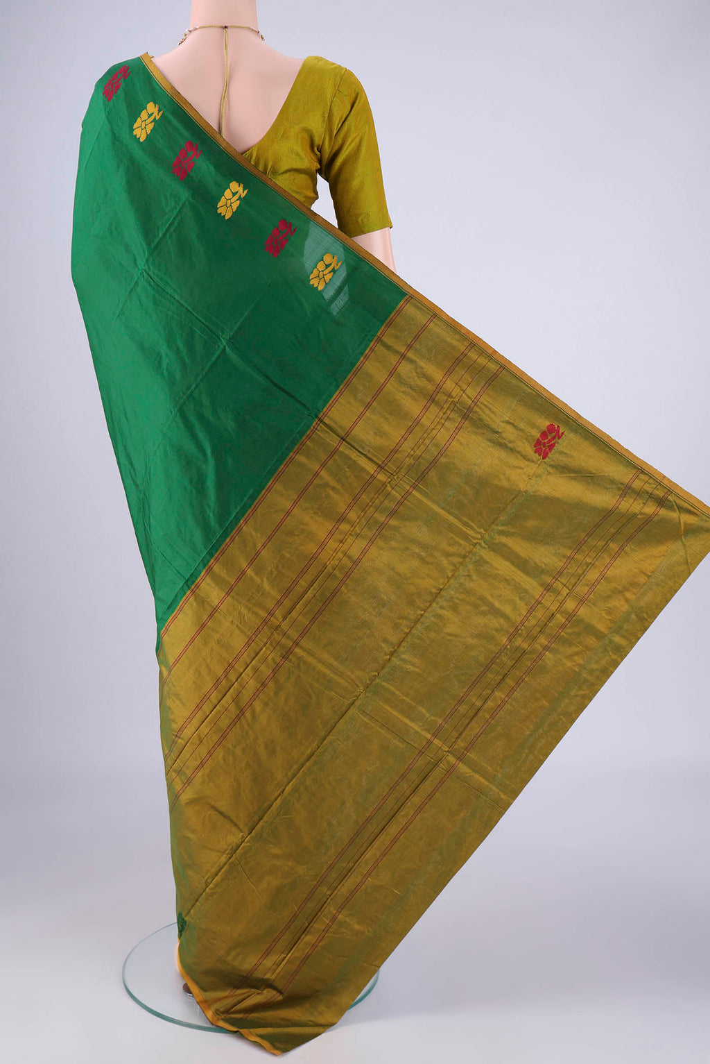 Flat view of Bottle Green Kanchipuram Silk Saree with Plain Body and Thread Border. 