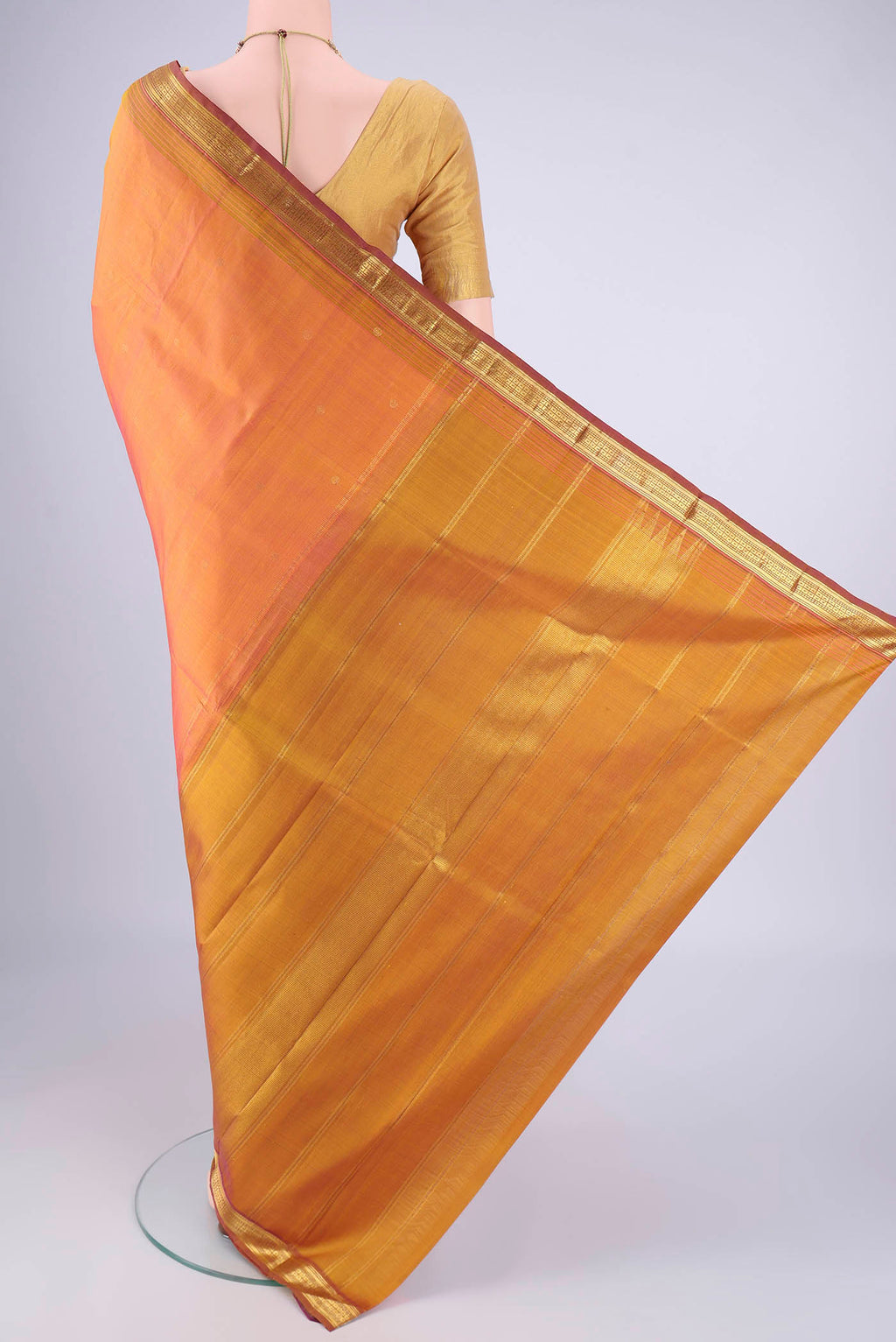 Flat view of Peach Dual Tone Kanjivaram Silk Saree with Zari Butta on the body and Zari Border. 