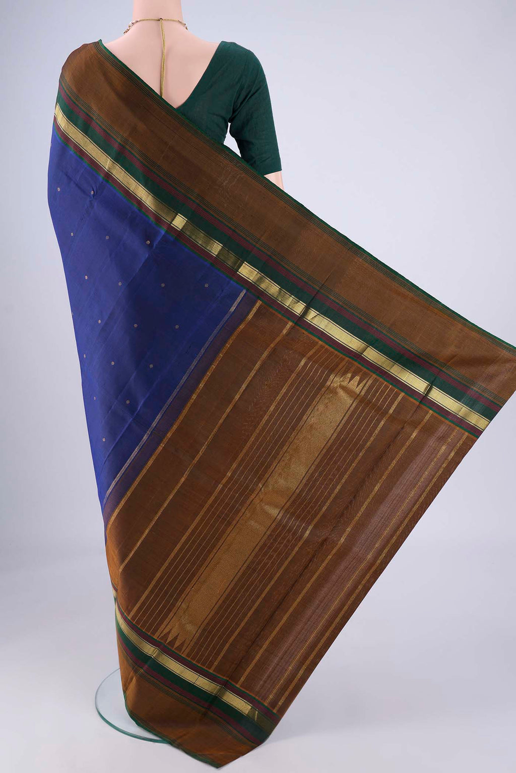 Flat view of Dark Blue Kanchipuram Silk Saree with Zari Butta on the body and Zari Border. 