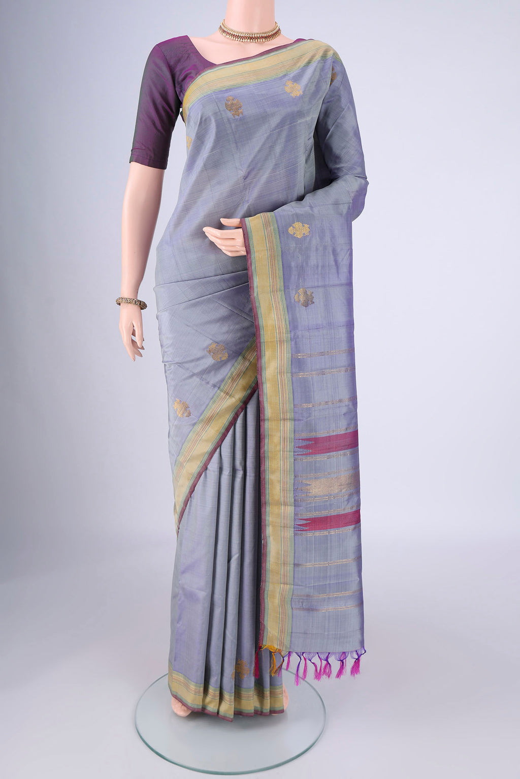 Blue Grey Kanjivaram Silk Saree with Plain Body and Zari Border.  displayed on a mannequin