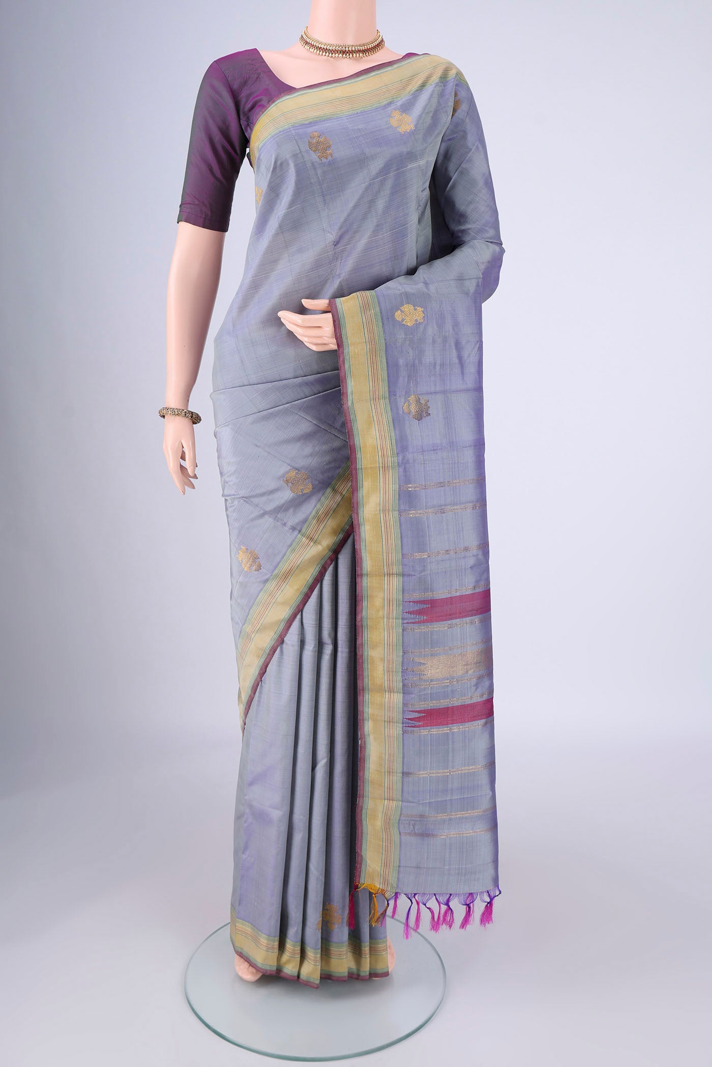Blue Grey Kanjivaram Silk Saree with Plain Body and Zari Border.  displayed on a mannequin