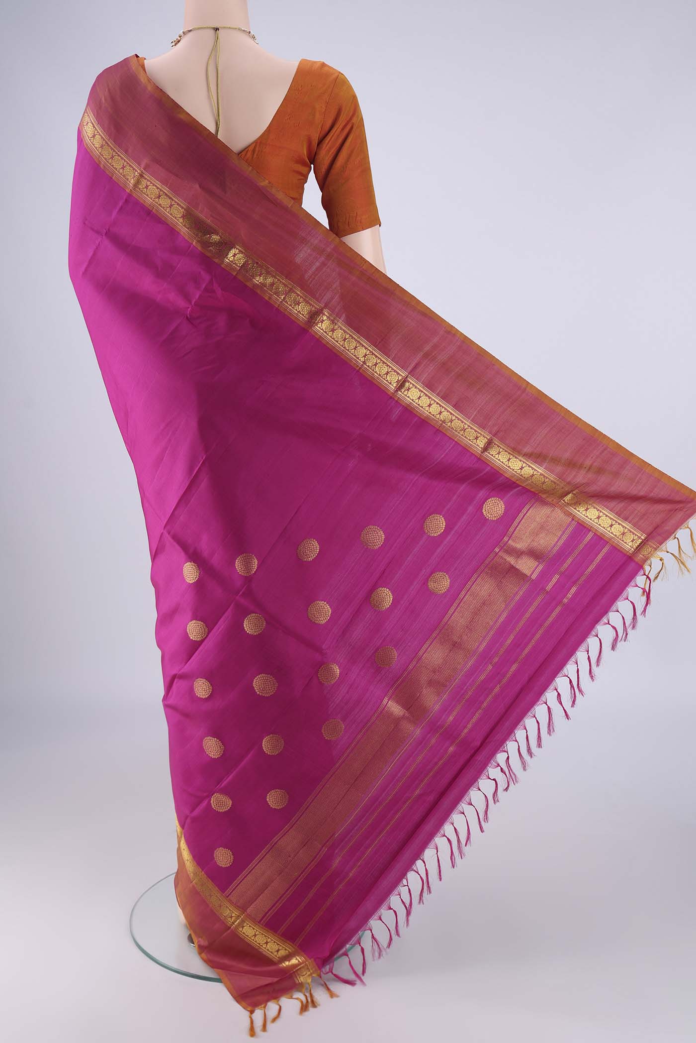 Flat view of Magenta Kanjivaram Silk Saree with Plain Body and Zari Border. 