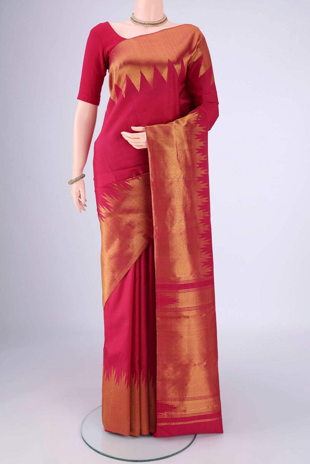 Maroon Kanjivaram Silk Saree with Plain Body and Temple Border.  displayed on a mannequin
