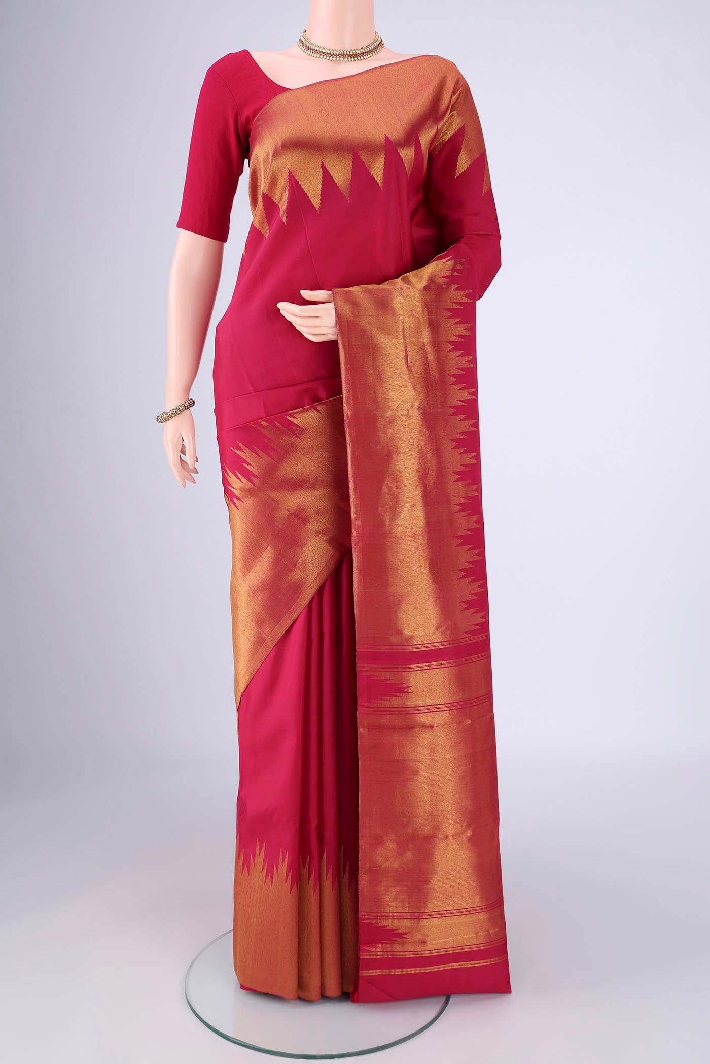 Maroon Kanjivaram Silk Saree with Plain Body and Temple Border.  displayed on a mannequin