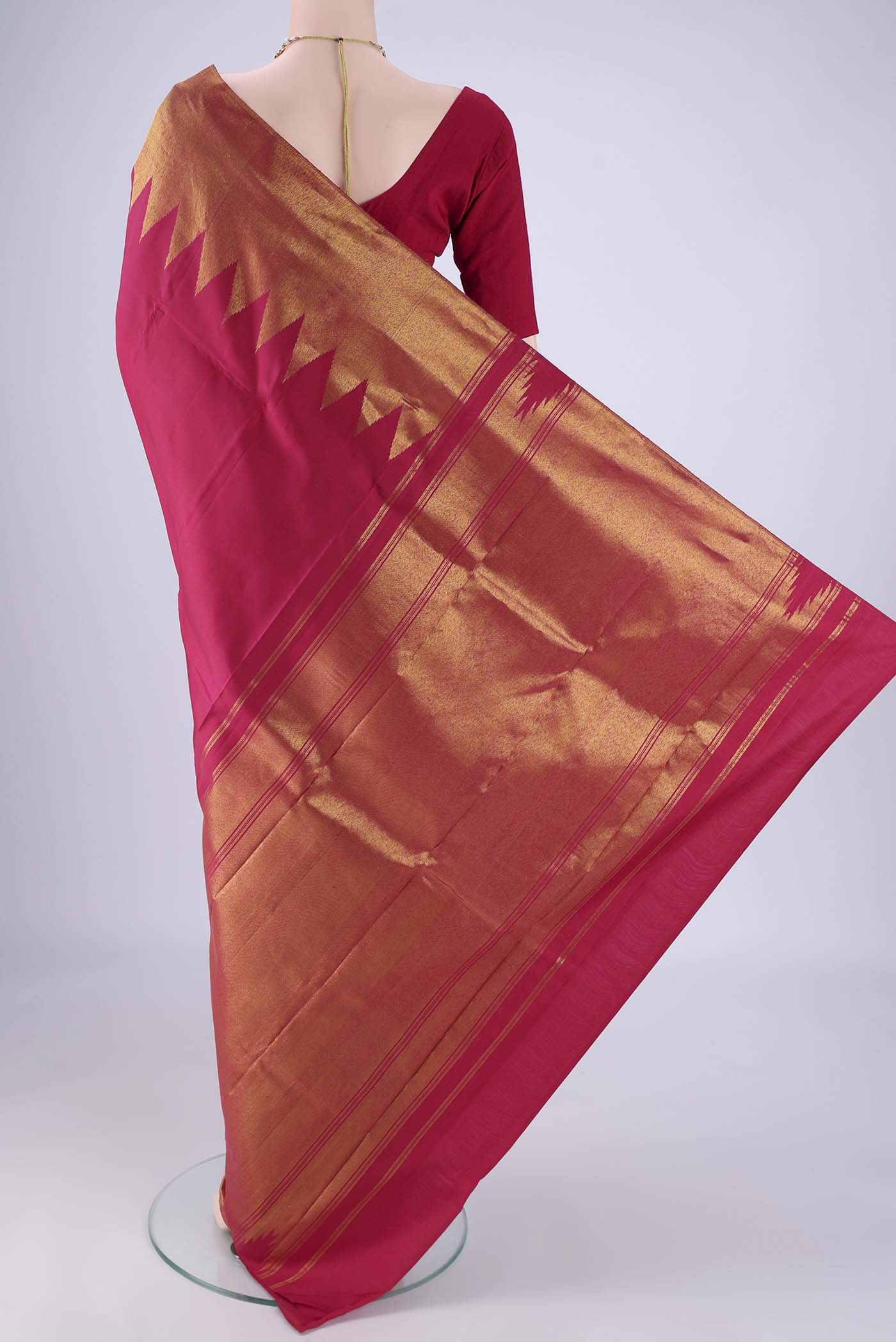 Flat view of Maroon Kanjivaram Silk Saree with Plain Body and Temple Border. 