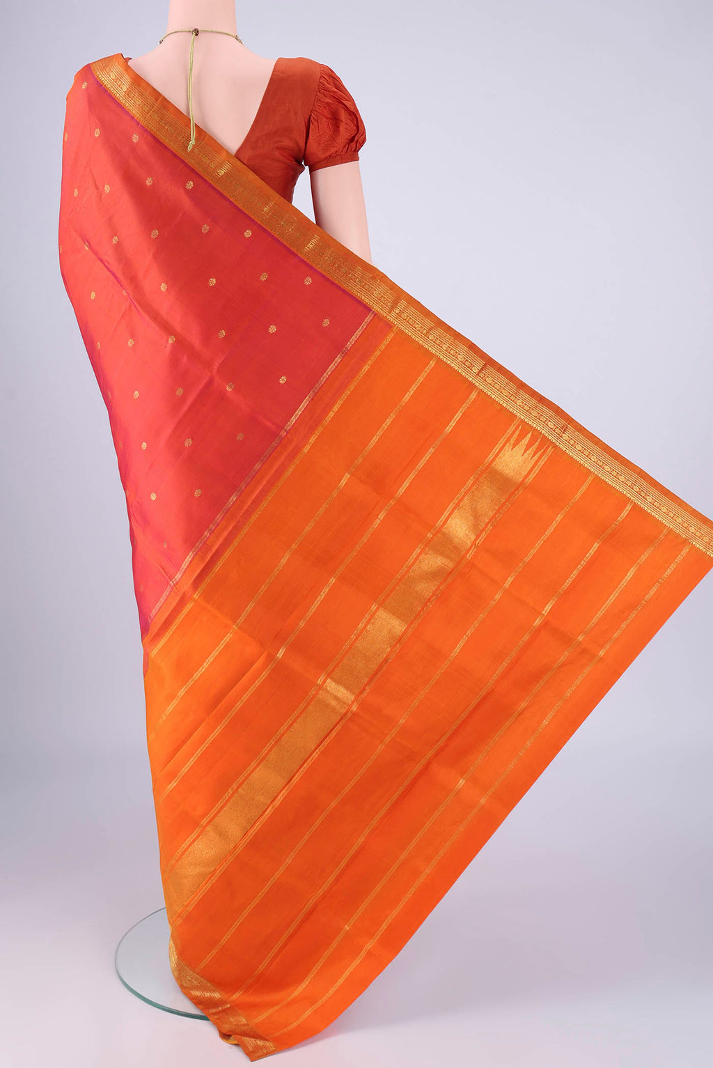 Flat view of Multi Color Kanchipuram Silk Saree with Zari Butta on the body and Zari Border. 