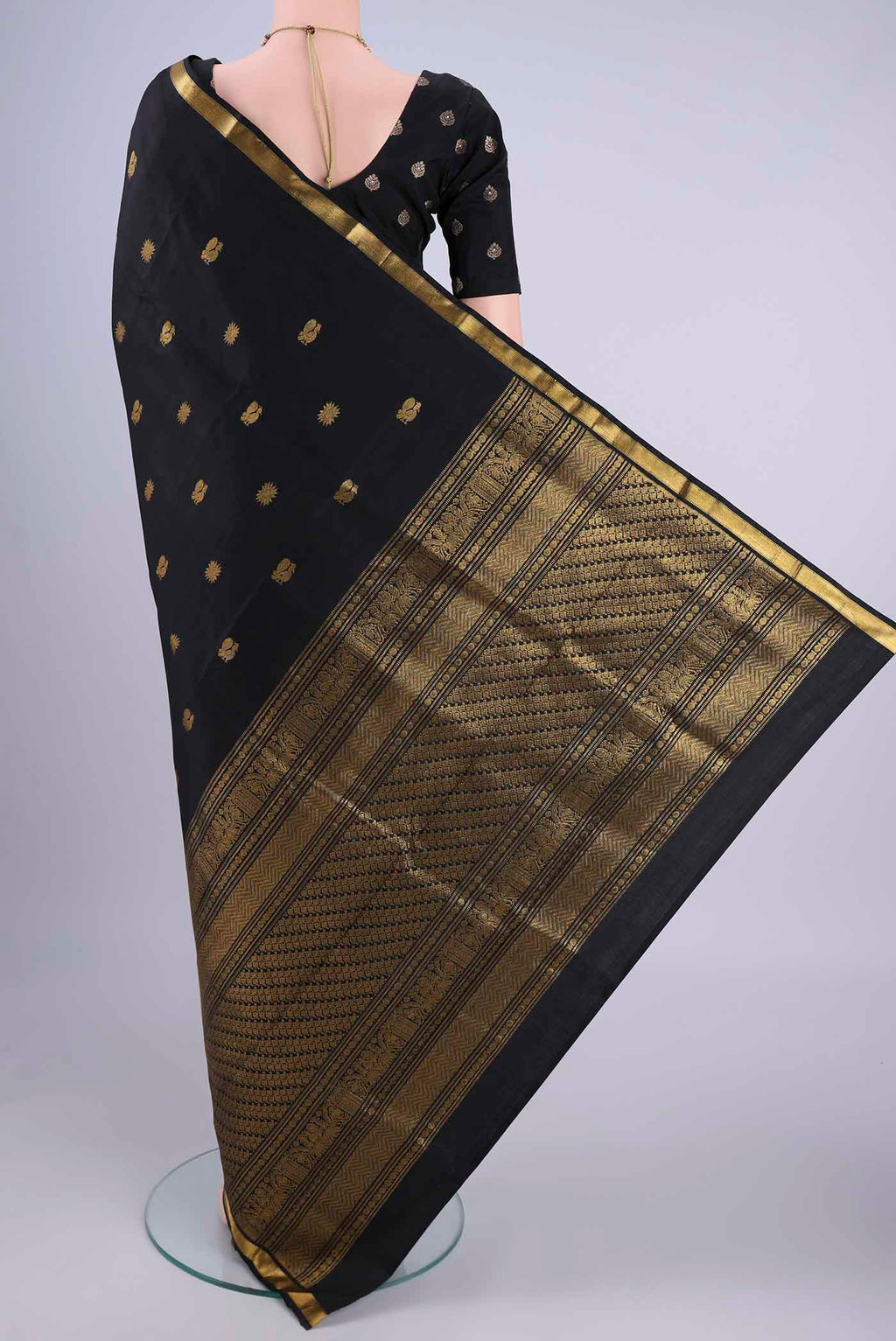 Flat view of Black Kanjivaram Silk Saree with Zari Butta on the body and Zari Border. 
