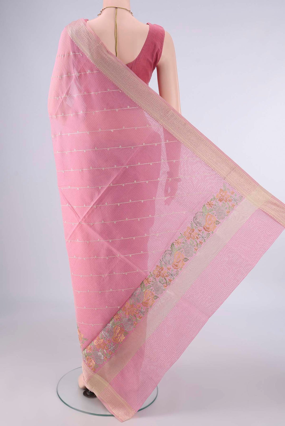 Flat view of Peach Kota Cotton Saree with Embroidery on the body and Zari And Thread Border. 