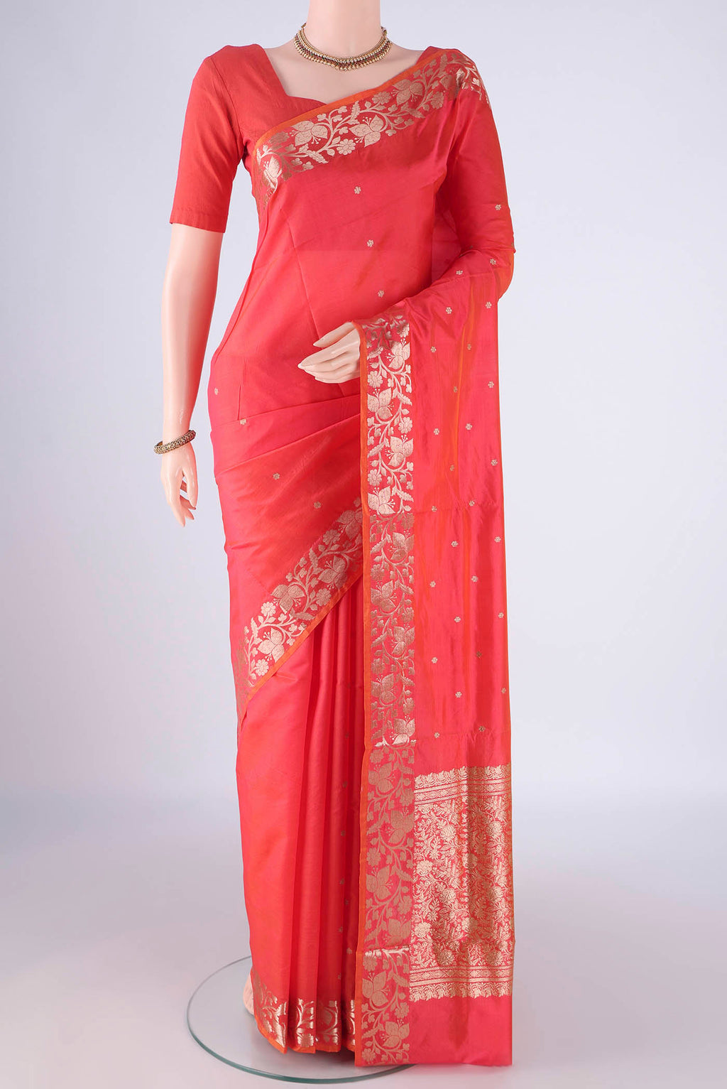 Orange Dual Tone Banarasi Katan Silk Saree with Zari Butta on the body and Zari Border.  displayed on a mannequin
