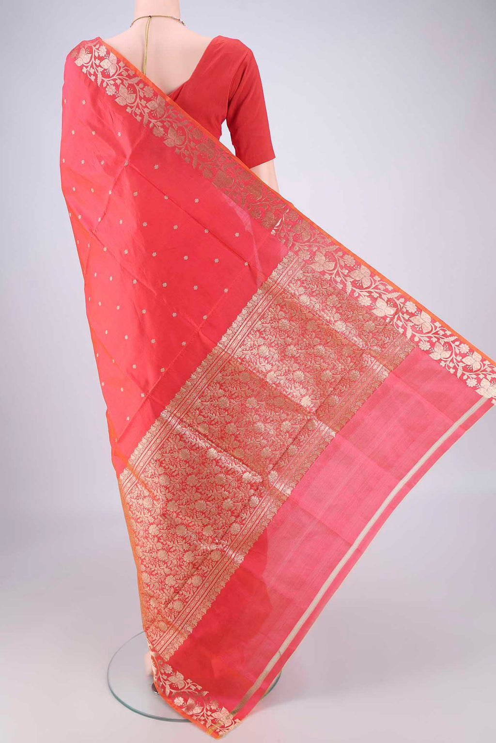 Flat view of Orange Dual Tone Banarasi Katan Silk Saree with Zari Butta on the body and Zari Border. 