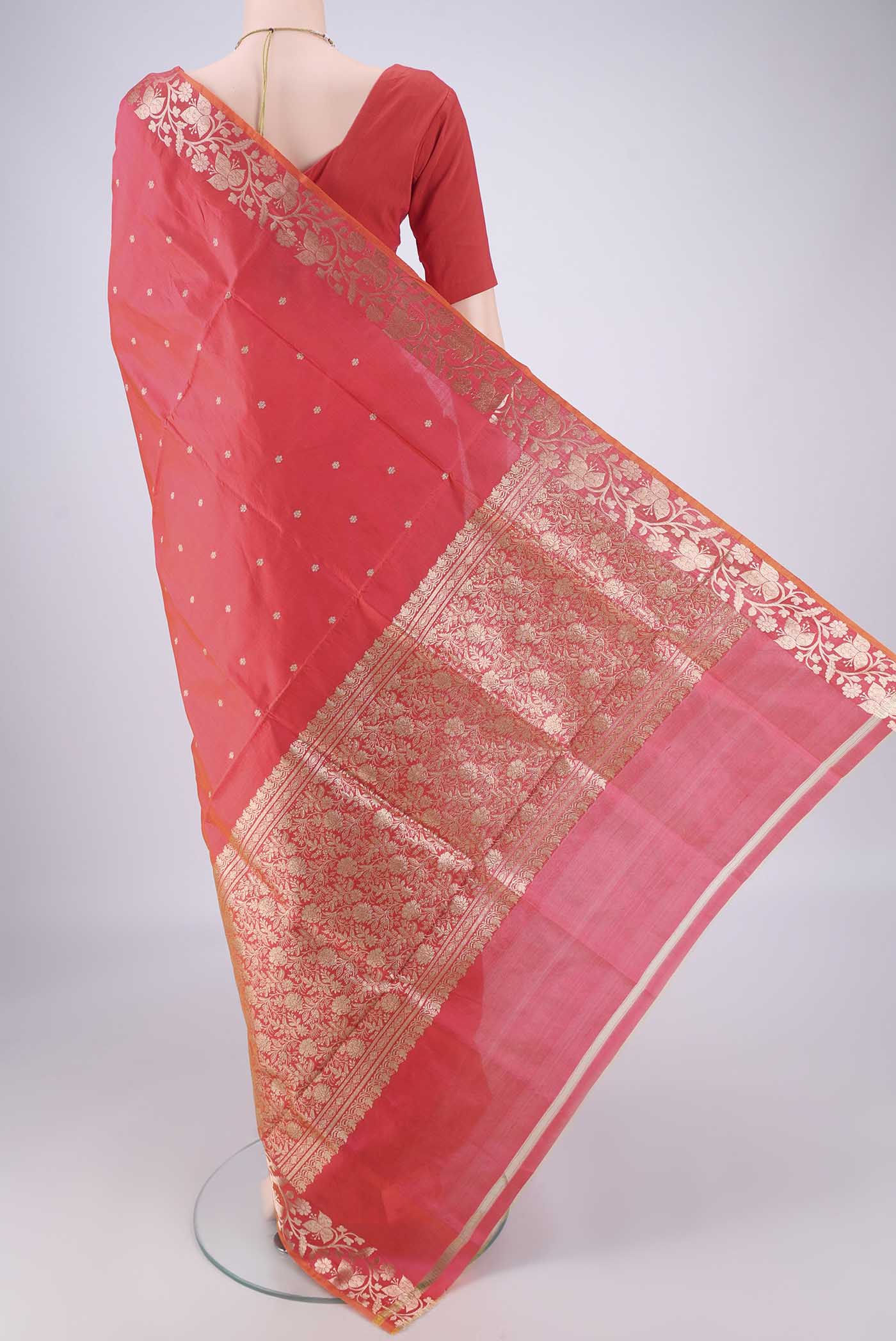 Flat view of Orange Dual Tone Banarasi Katan Silk Saree with Zari Butta on the body and Zari Border. 