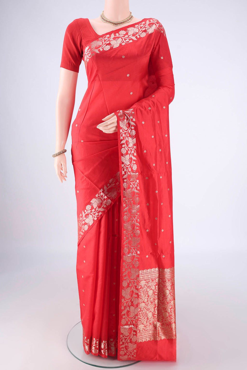 Red Dual Tone Banarasi Katan Silk Saree with Zari Butta on the body and Zari Border.  displayed on a mannequin