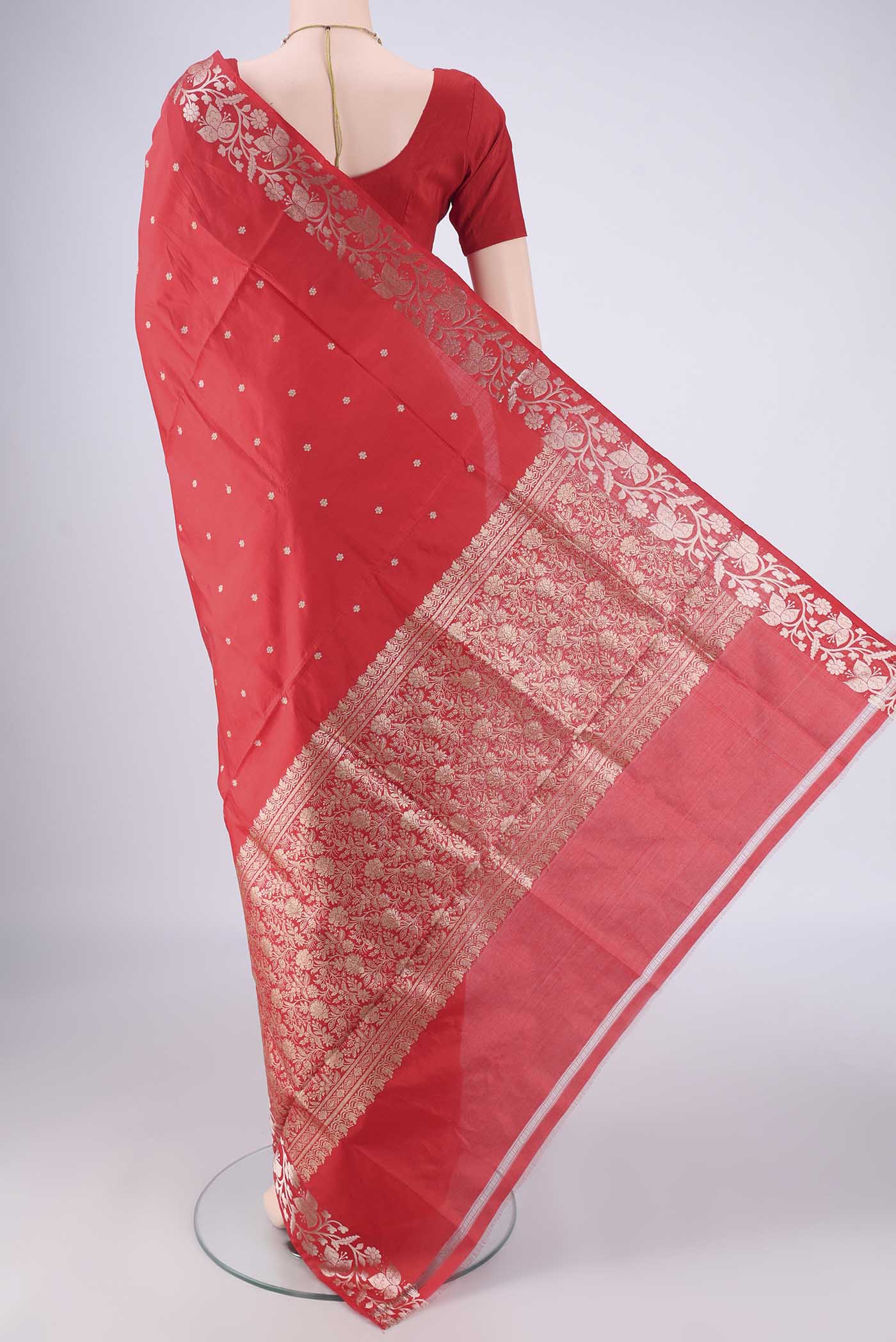 Flat view of Red Dual Tone Banarasi Katan Silk Saree with Zari Butta on the body and Zari Border. 