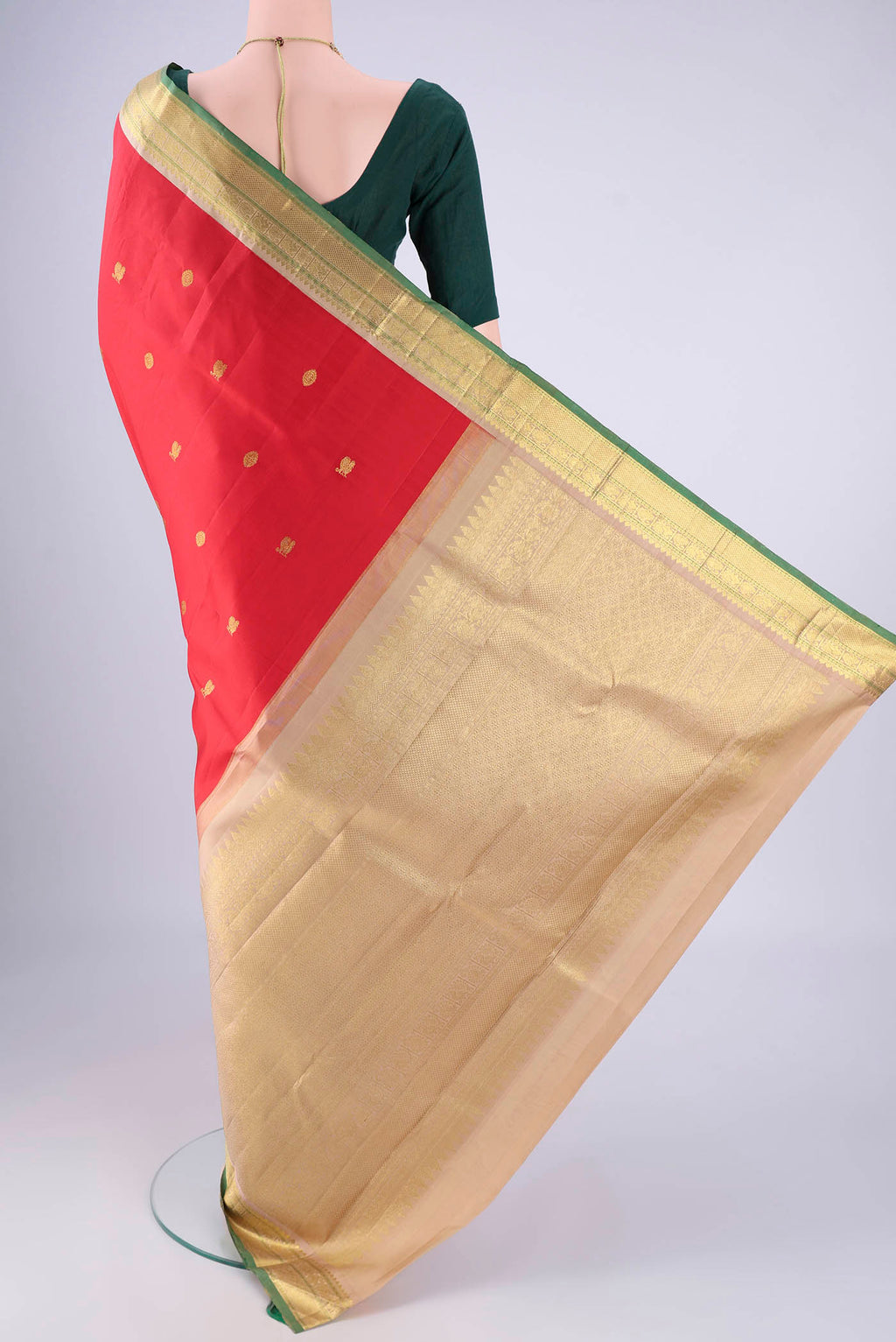 Flat view of Red Kanjivaram Silk Saree with Zari Butta on the body and Zari Border. 