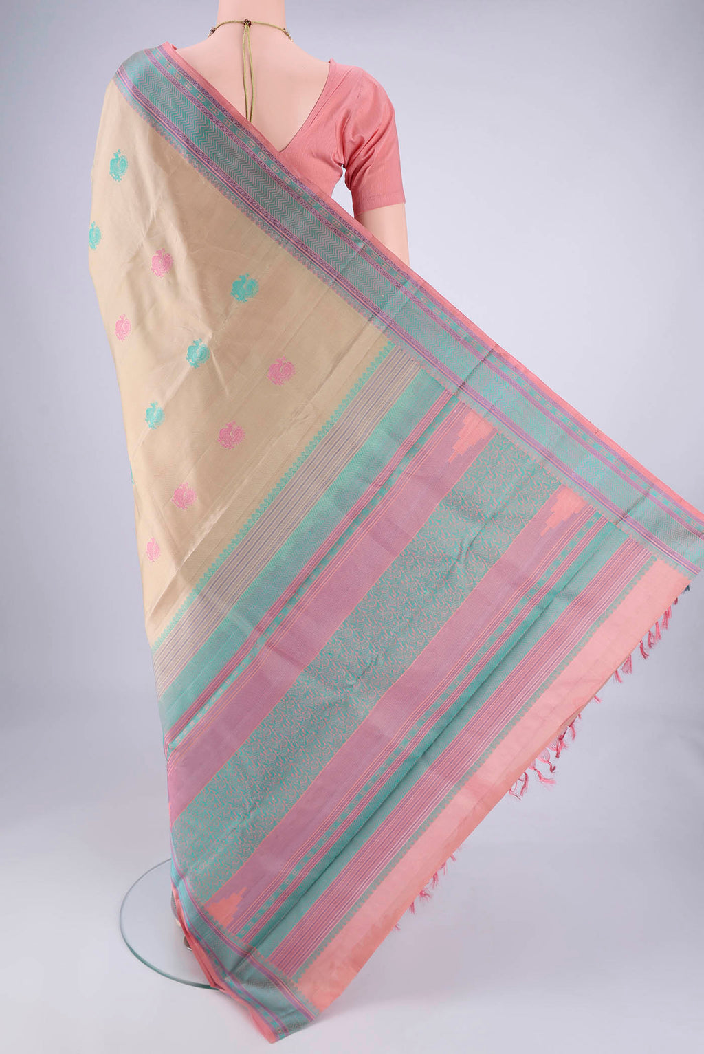 Flat view of Beige Kanchipuram Silk Saree with Thread Butta on the body and Thread Border. 