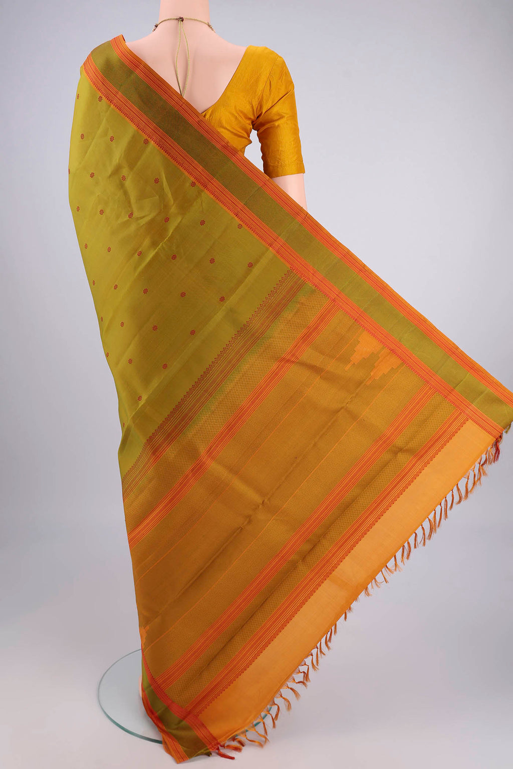 Flat view of Light Green Kanchipuram Silk Saree with Thread Butta on the body and Thread Border. 
