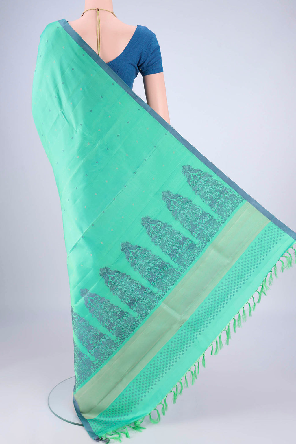 Flat view of Sea Green Kanjivaram Silk Saree with Thread Butta on the body and Plain Border. 