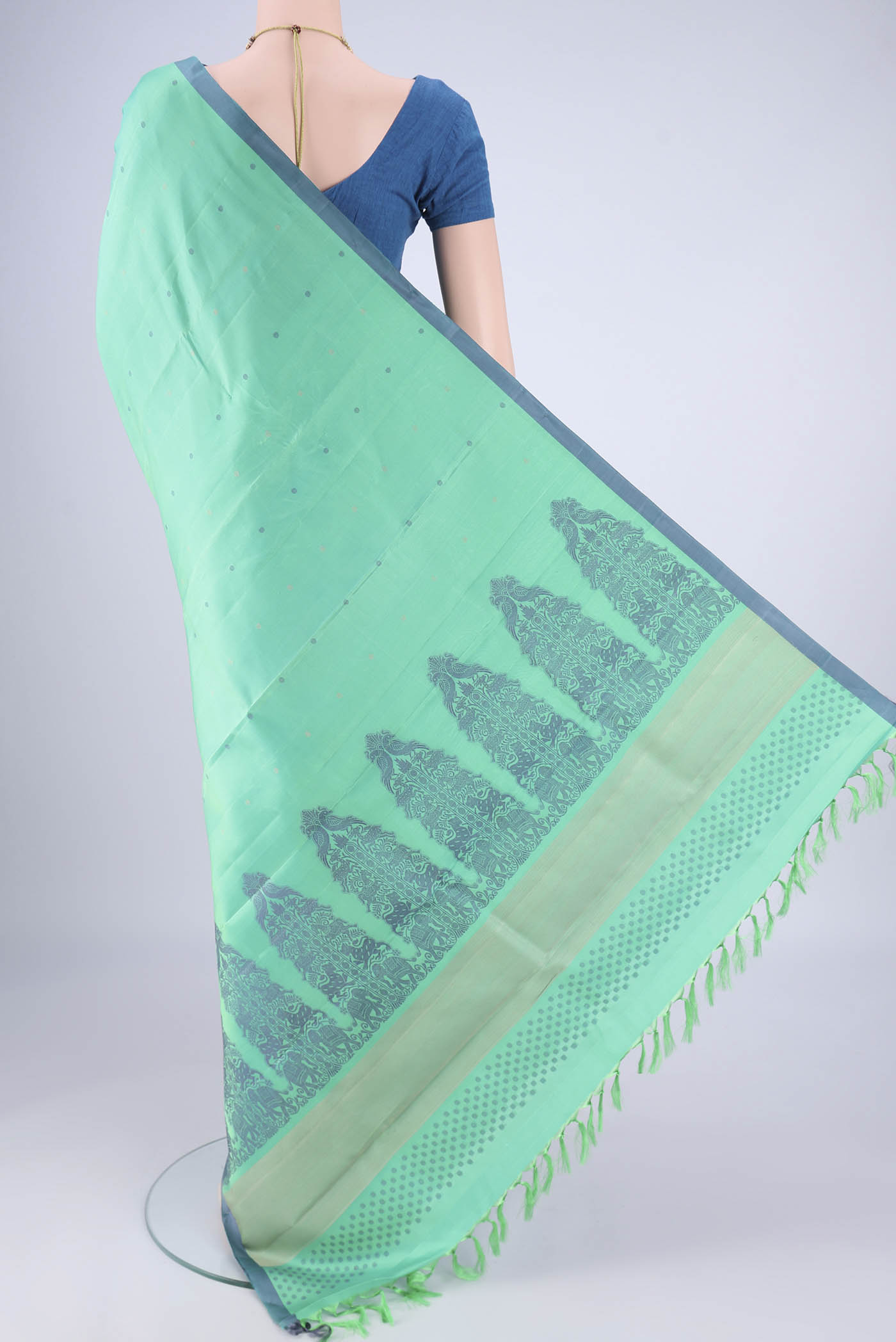 Flat view of Sea Green Kanjivaram Silk Saree with Thread Butta on the body and Plain Border. 