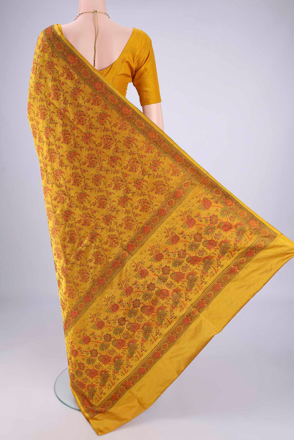 Flat view of Yellow Banarasi Tanchoi Silk Saree with Jacquard design on the body and Temple Thread Border. 