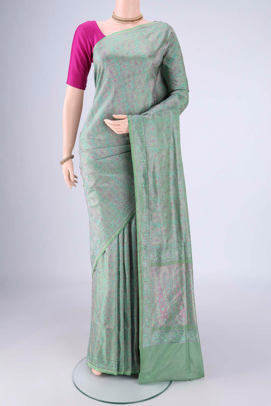 Mint Green Banarasi Tanchoi Silk Saree with Jacquard design on the body and Thread Border.  displayed on a mannequin