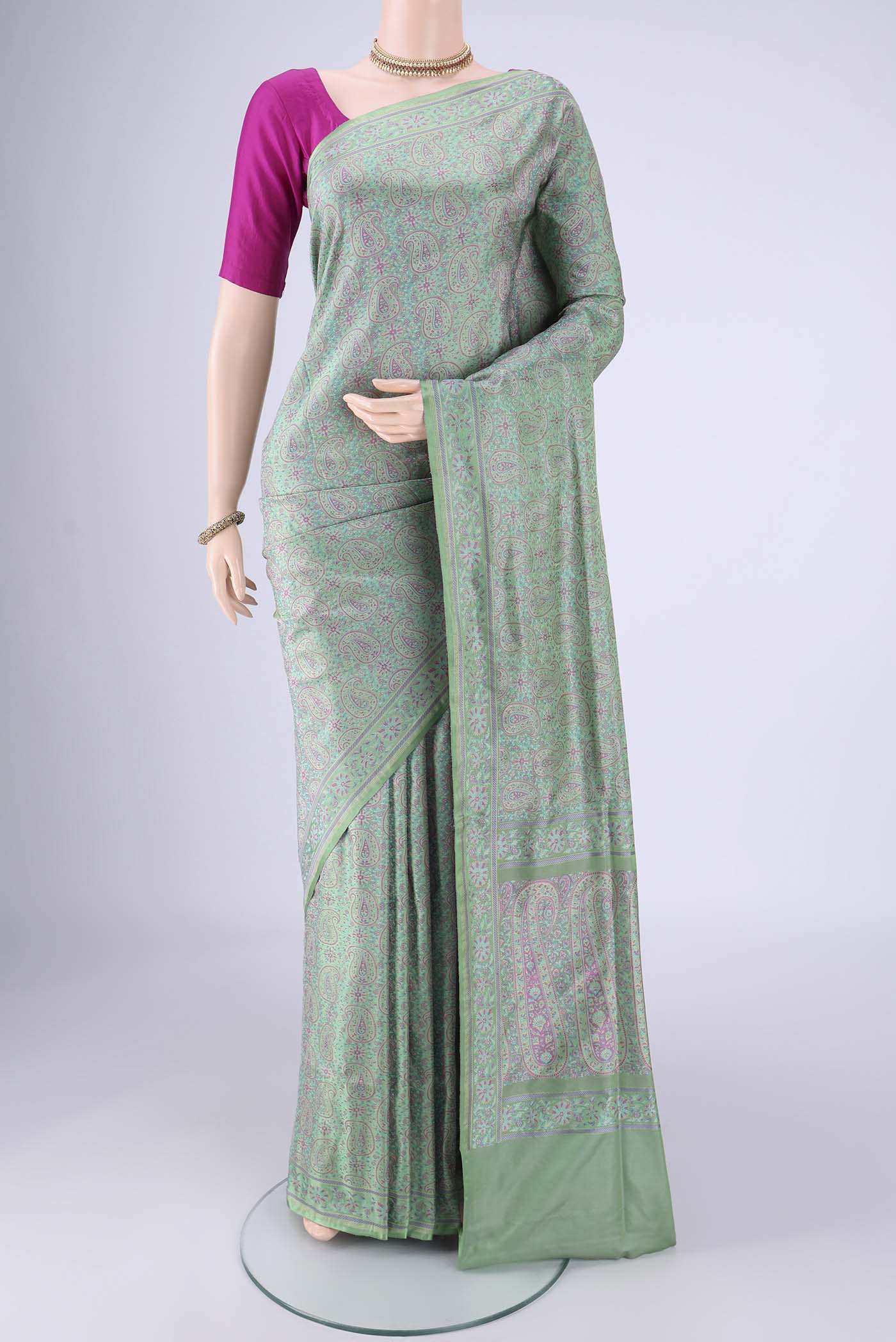 Mint Green Banarasi Tanchoi Silk Saree with Jacquard design on the body and Thread Border.  displayed on a mannequin
