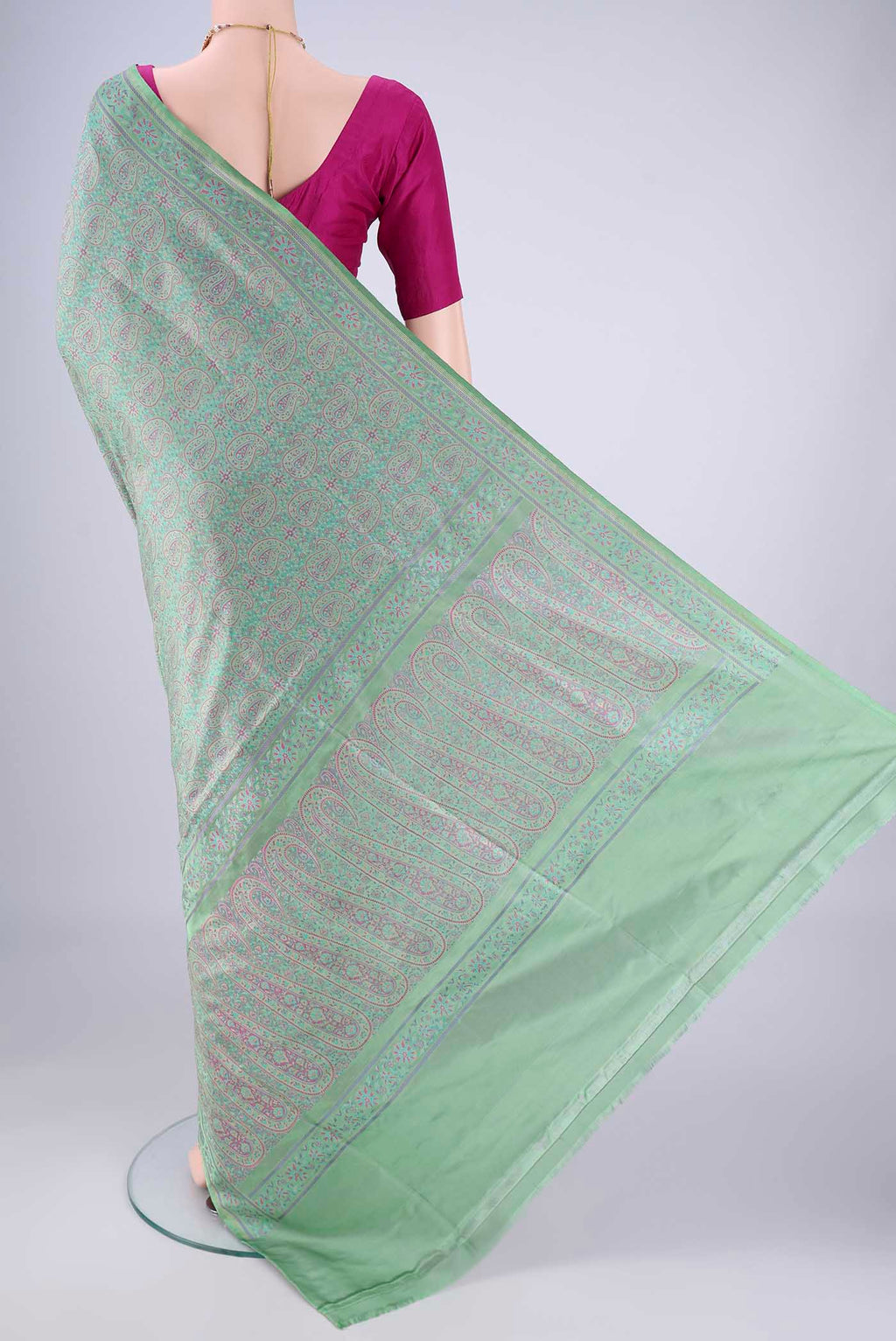 Flat view of Mint Green Banarasi Tanchoi Silk Saree with Jacquard design on the body and Thread Border. 