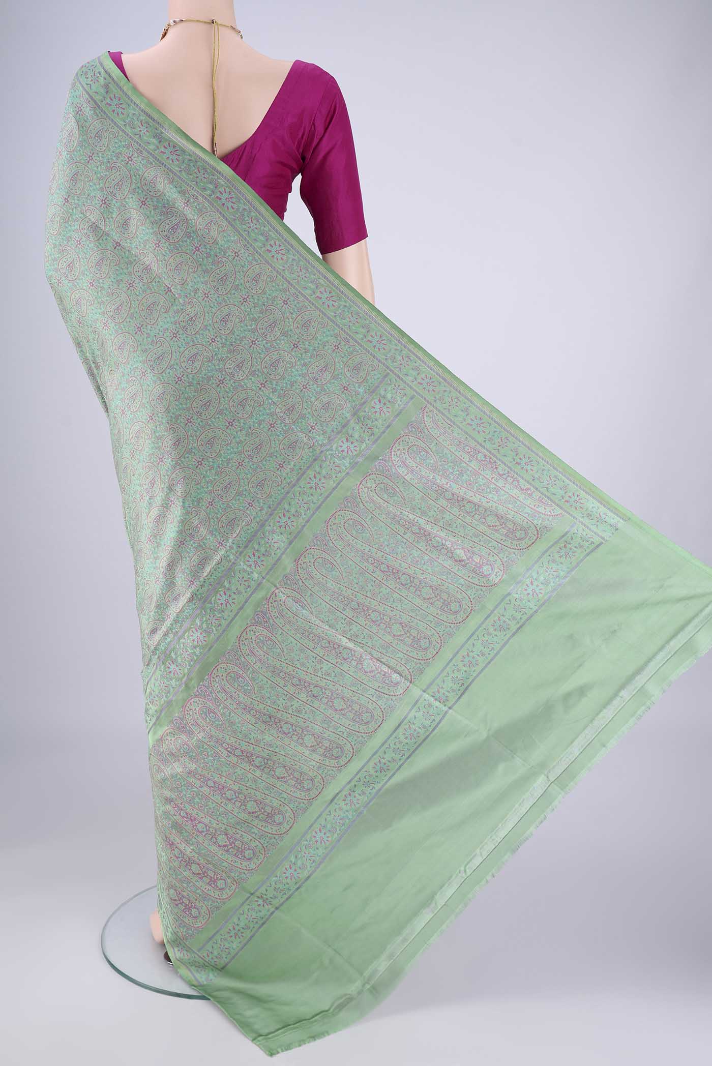 Flat view of Mint Green Banarasi Tanchoi Silk Saree with Jacquard design on the body and Thread Border. 