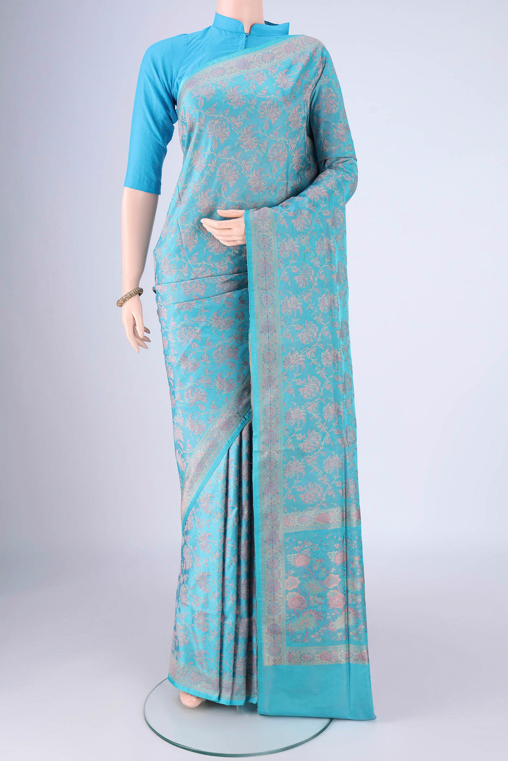 Sky Blue Banarasi Tanchoi Silk Saree with Jacquard design on the body and Thread Border.  displayed on a mannequin
