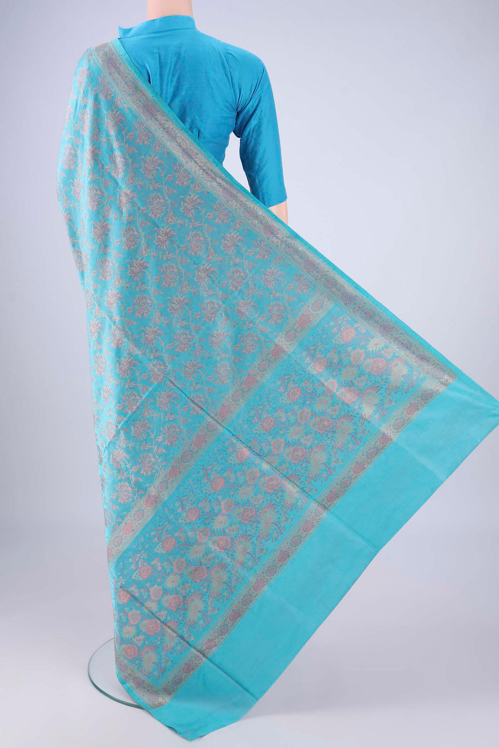 Flat view of Sky Blue Banarasi Tanchoi Silk Saree with Jacquard design on the body and Thread Border. 