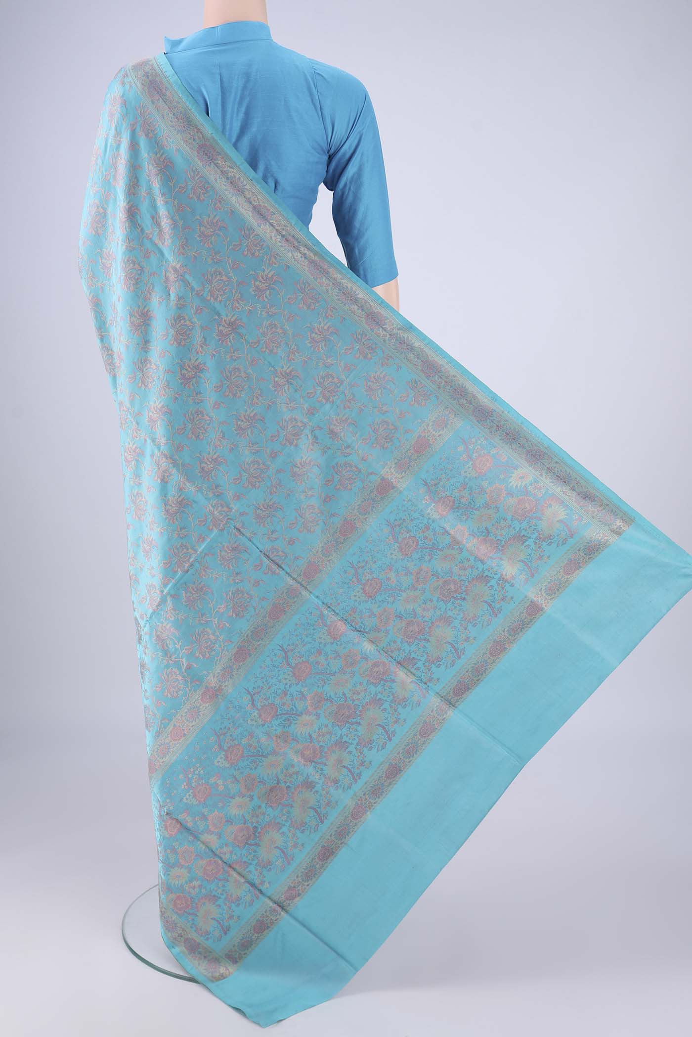 Flat view of Sky Blue Banarasi Tanchoi Silk Saree with Jacquard design on the body and Thread Border. 