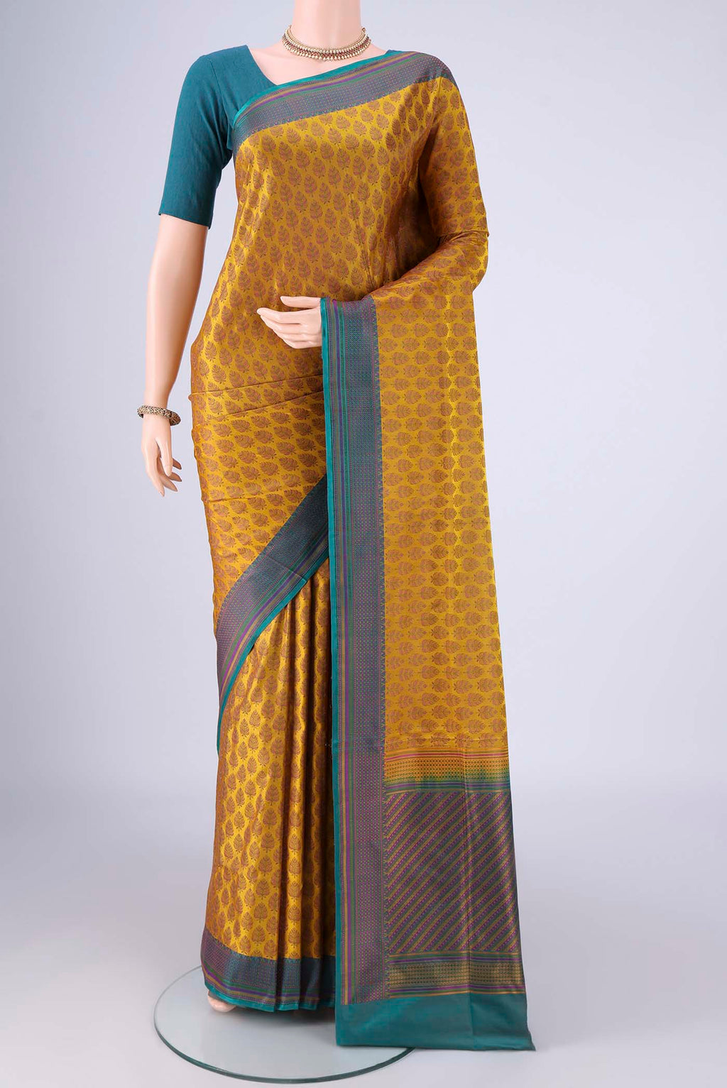 Mustard Banarasi Tanchoi Silk Saree with Jacquard design on the body and Thread Border.  displayed on a mannequin