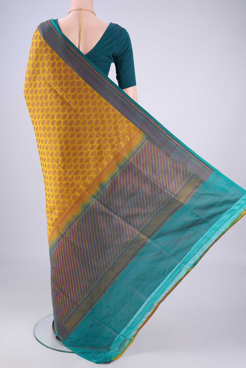 Flat view of Mustard Banarasi Tanchoi Silk Saree with Jacquard design on the body and Thread Border. 