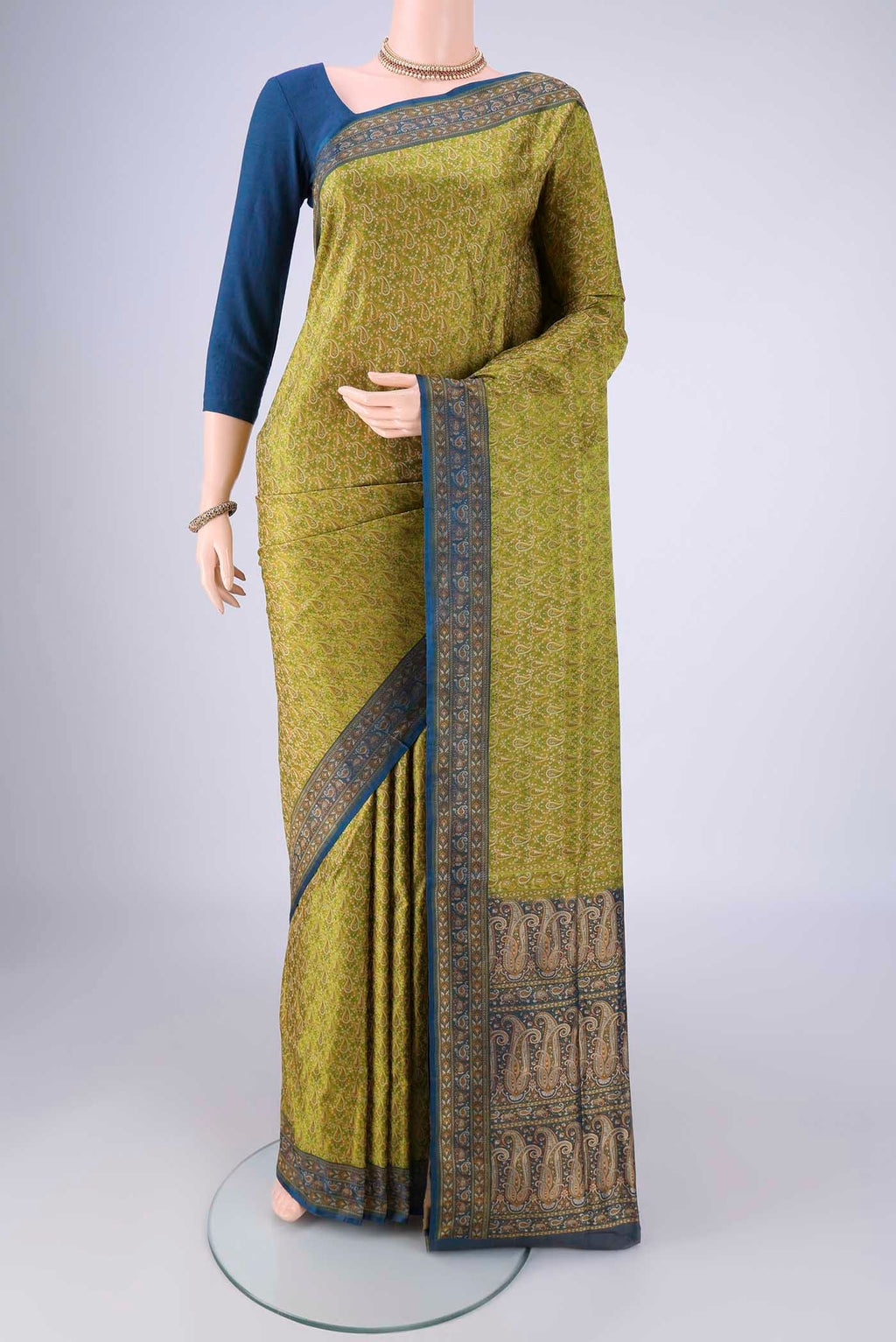 Light Green Banarasi Tanchoi Silk Saree with Jacquard design on the body and Thread Border.  displayed on a mannequin