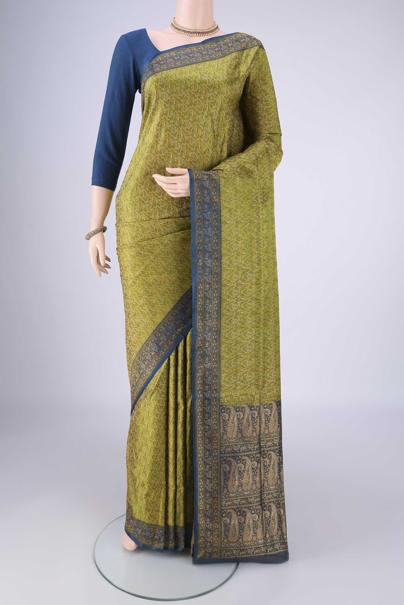 Light Green Banarasi Tanchoi Silk Saree with Jacquard design on the body and Thread Border.  displayed on a mannequin