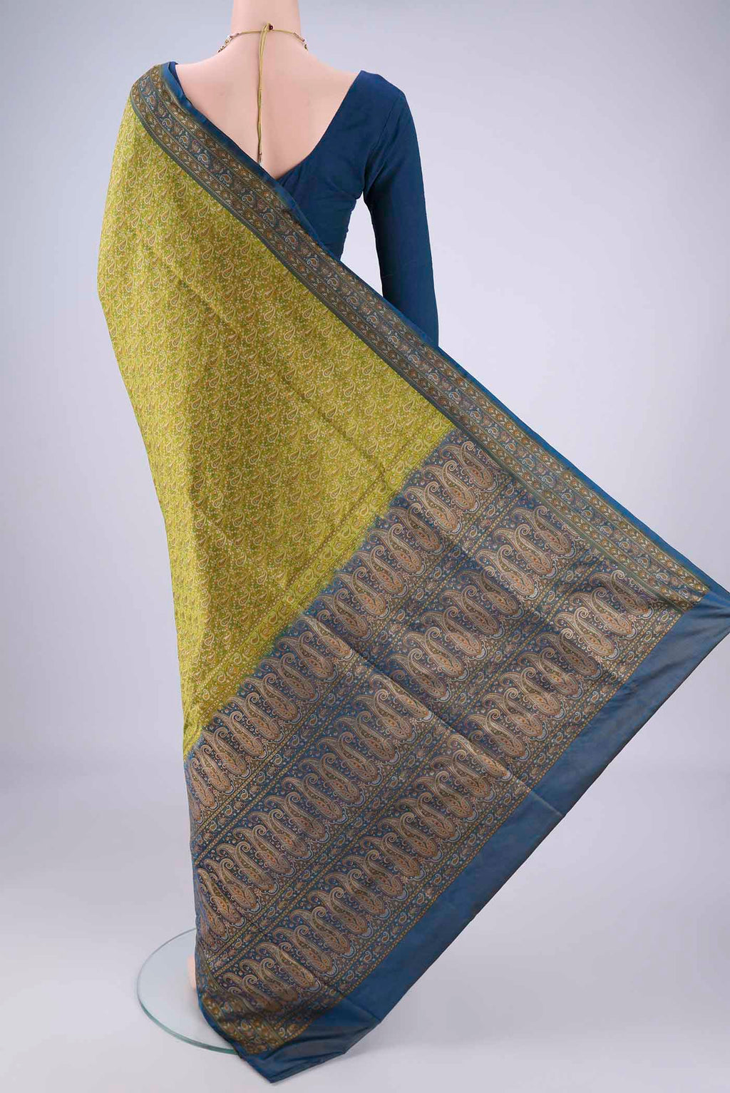 Flat view of Light Green Banarasi Tanchoi Silk Saree with Jacquard design on the body and Thread Border. 