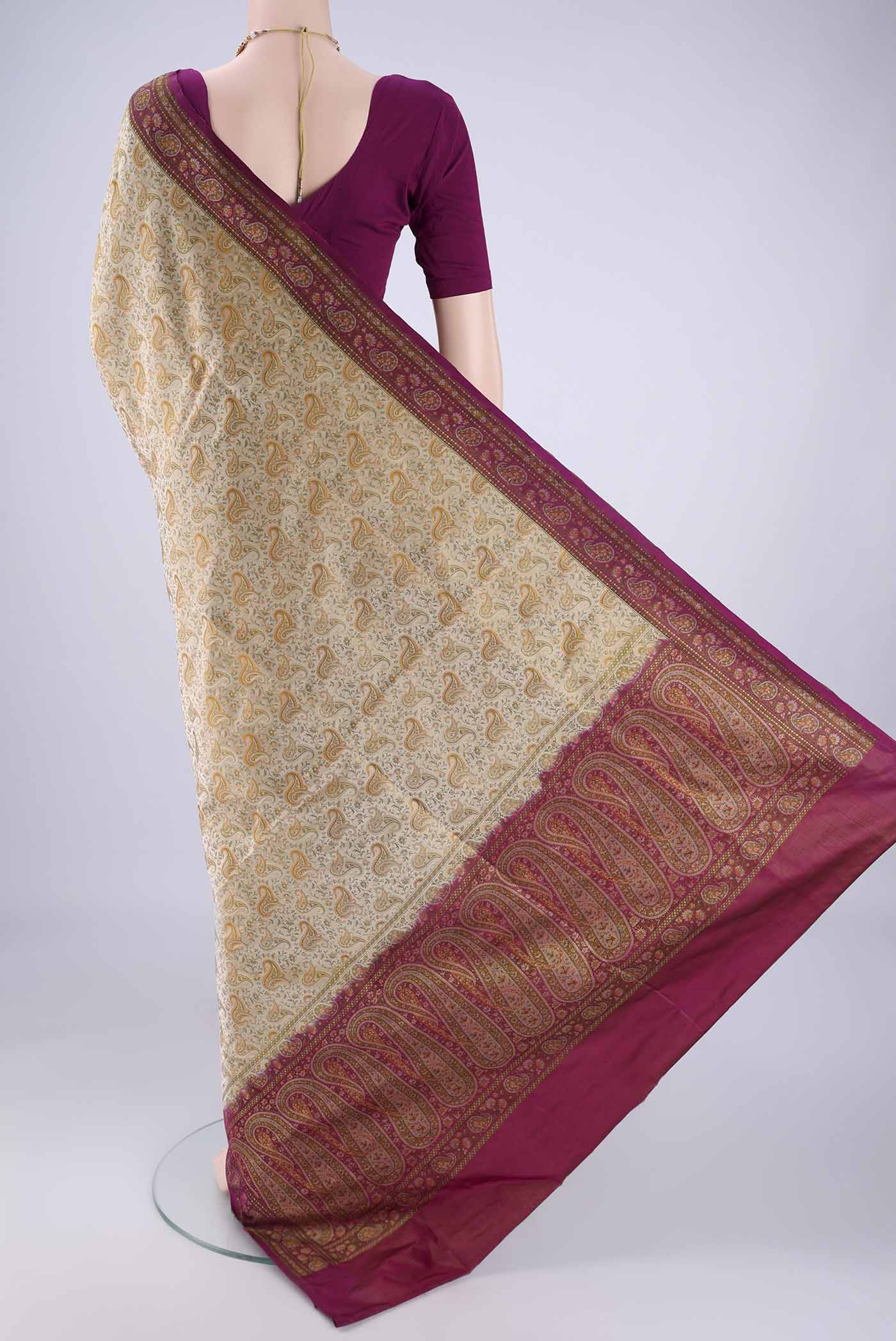 Flat view of Beige Banarasi Tanchoi Silk Saree with Jacquard design on the body and Thread Border. 