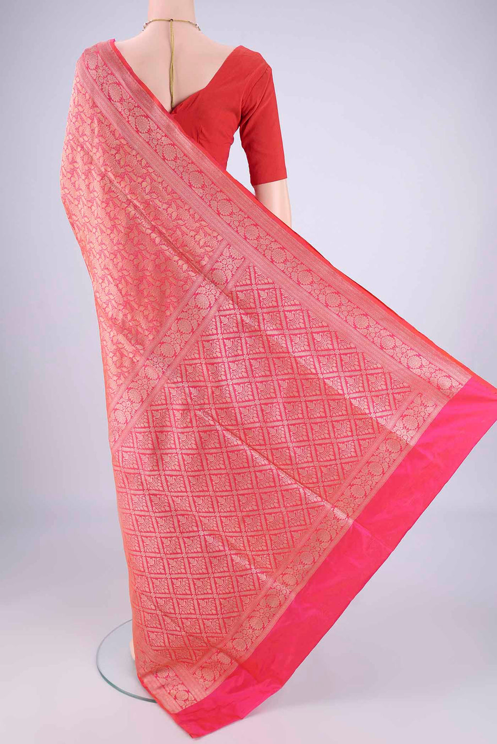 Flat view of Pink Banarasi Silk Saree with Zari Brocade on the body and Zari Border. 